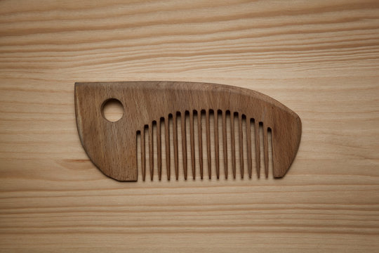 Wooden comb for combing hair