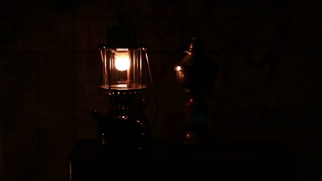 Oil lamp in dark night at home no electricity