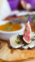  Bruschetta with figs,cheese and carmelitani onions. selective focus