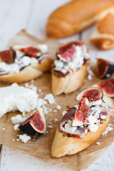 Bruschetta with figs,goat cheese and balsamic sauce.selective focus