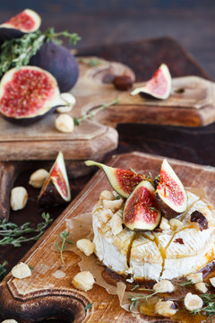 Baked Camembert with Figs,  hazelnuts and thyme.selective focus