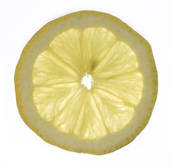 Slice of fresh lemon isolated on white background