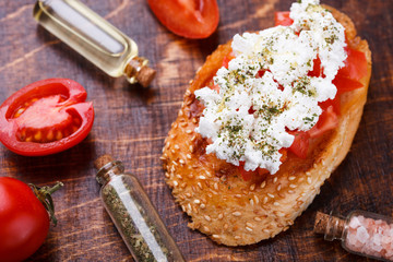 Bruschetta with tomato and feta cheese. selective focus