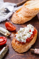 Bruschetta with tomato and feta cheese. selective focus