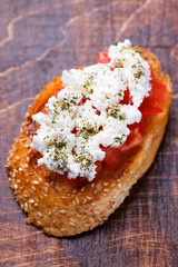 Bruschetta with tomato and feta cheese. selective focus