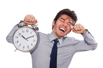 Young businessman with clock isolated on white