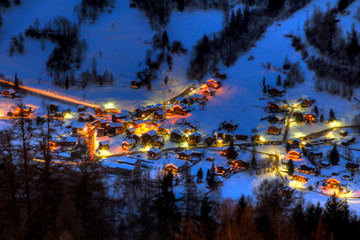 Night view of the mountain village of Vissoie, canton of Valais, Switzerland, taken from uphill at the village of St Luc