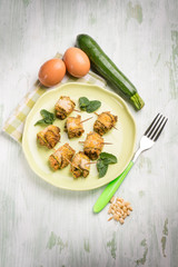 filled rolled up zucchinis with pine nuts