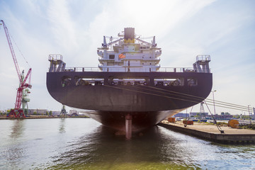 Huge container ship at dry docks in Port of Antwerp