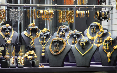 gold jewelry, selling in the market, luxurious gold counter © kolyadzinskaya