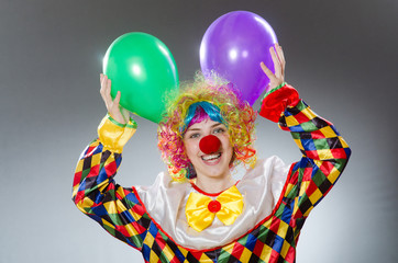 Clown with balloons in funny concept