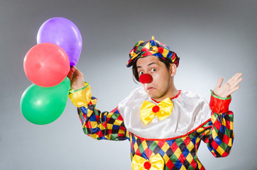 Clown with balloons in funny concept