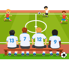 Fototapeta premium Children soccer team sitting on a bench