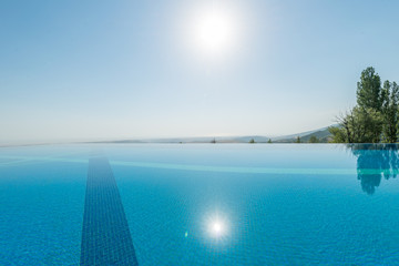 Infinity pool on the bright summer day