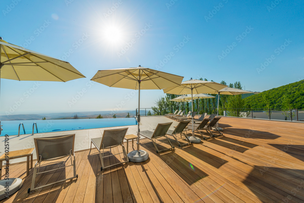 Poster infinity pool on the bright summer day