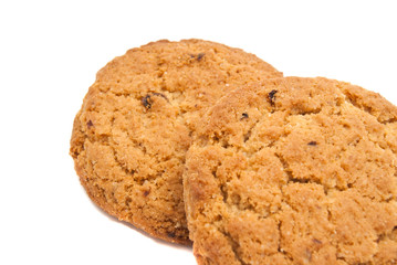 Two fresh oatmeal cookies on white