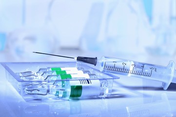 plastic medical syringe and ampoule