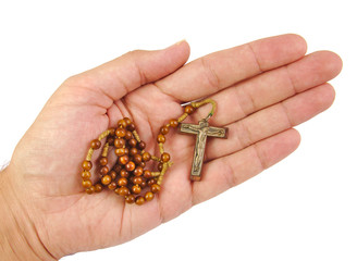 Hand with rosary isolated on a white background