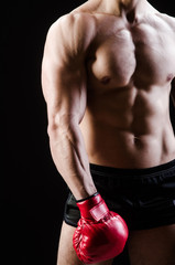 Naklejka premium Muscular man in boxing concept