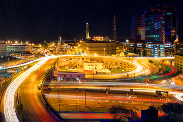 Fototapeta premium Traffic to the port of Genova. Flyover famous overpass at night