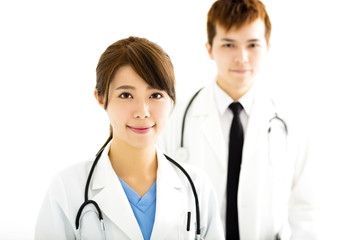 Fototapeta premium smiling male and female doctors standing together
