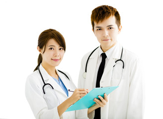 smiling male and female doctors standing together