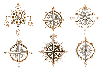 Set of vintage wind roses, compasses. Icons and design elements.