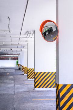 Traffic convex mirror at car park.