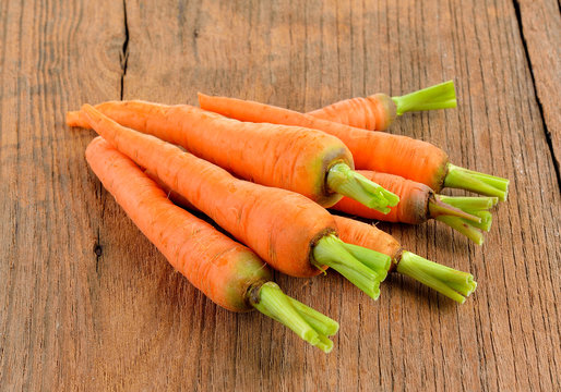 baby carrots on wooden  background