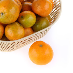 orange fruit in basket, isolated on white background