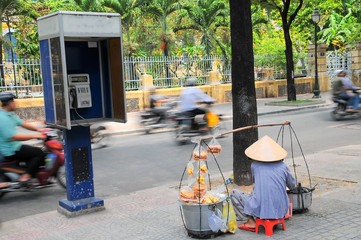 Street vendor on street in Ho Chi Minh city, Vietnam. 