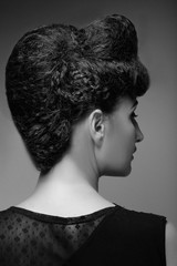Woman with elegant hairstyle. Rear view.