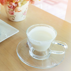 hot drink milk on wood table in the morning
