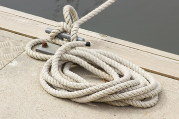 Yachting, white rope and mooring bollard