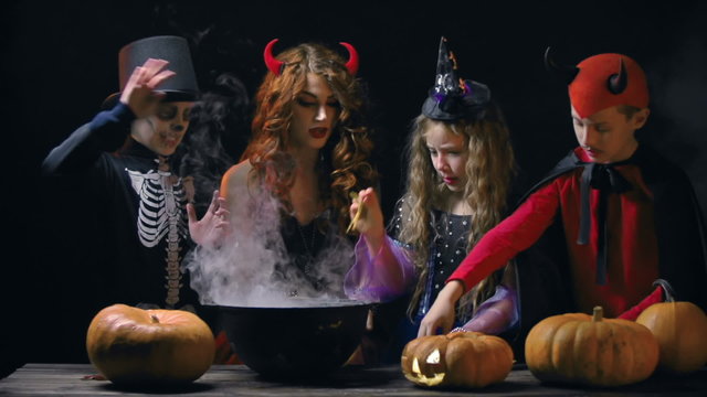 Devil woman teaching little evil characters to cook magic potion 