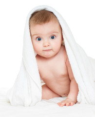 Beautiful happy baby  in a towel after bath. One, isolated on wh