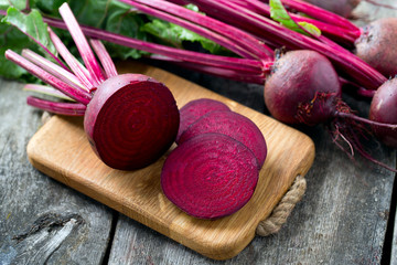 fresh sliced beetroot on wooden surface - 91041745