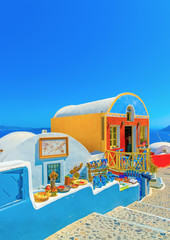 Typical colorful narrow street in Oia the most beautiful village of Santorini island in Greece - 91046913