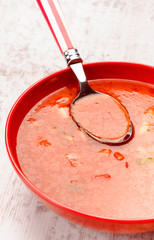 Andalusian gazpacho in red bowl modern