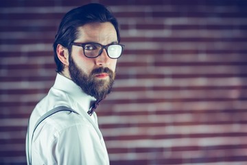 Portrait of confident hipster wearing eyeglasses