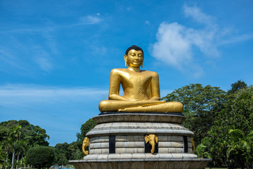 Beautiful landscape and golden buddha statue in Viharamahadevi Park, Colombo, SriLanka