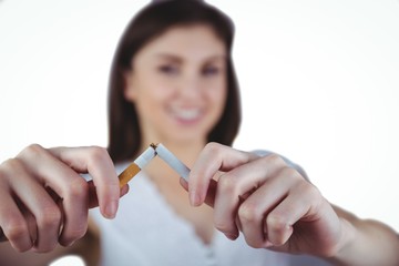 Woman snapping cigarette in half