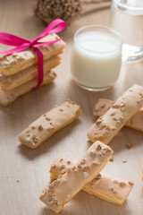 Pile of puff pastry topping with sugar and nut.