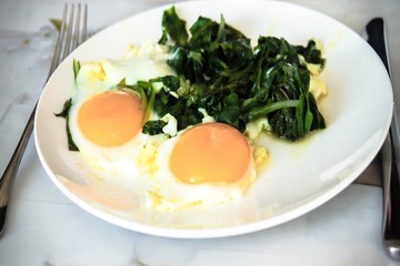 Creamy spinach with fried egg. Healthy breakfast