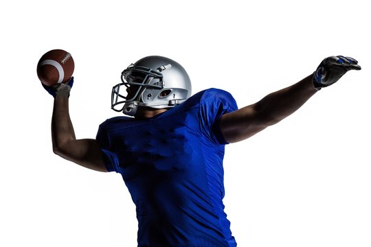 American Football Player Throwing Ball