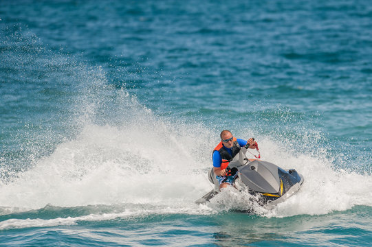 Young Man on Jet Ski, Tropical Ocean, Vacation Concept