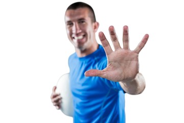 Portrait of happy rugby player defending