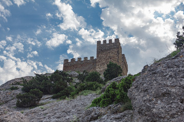 Fototapeta na wymiar Old defensive fortress on rocky shore of the sea