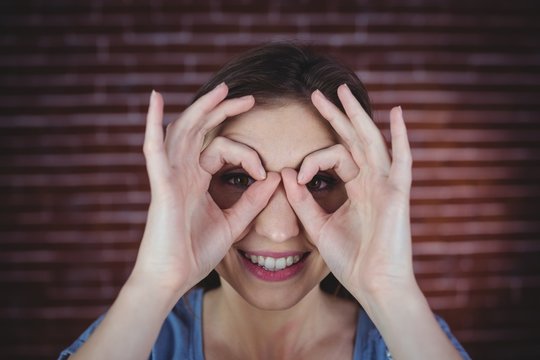 Woman Holding Hands As Binoculars 