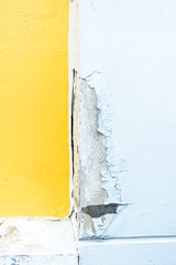 cracked yellow paint color concrete wall,texture background